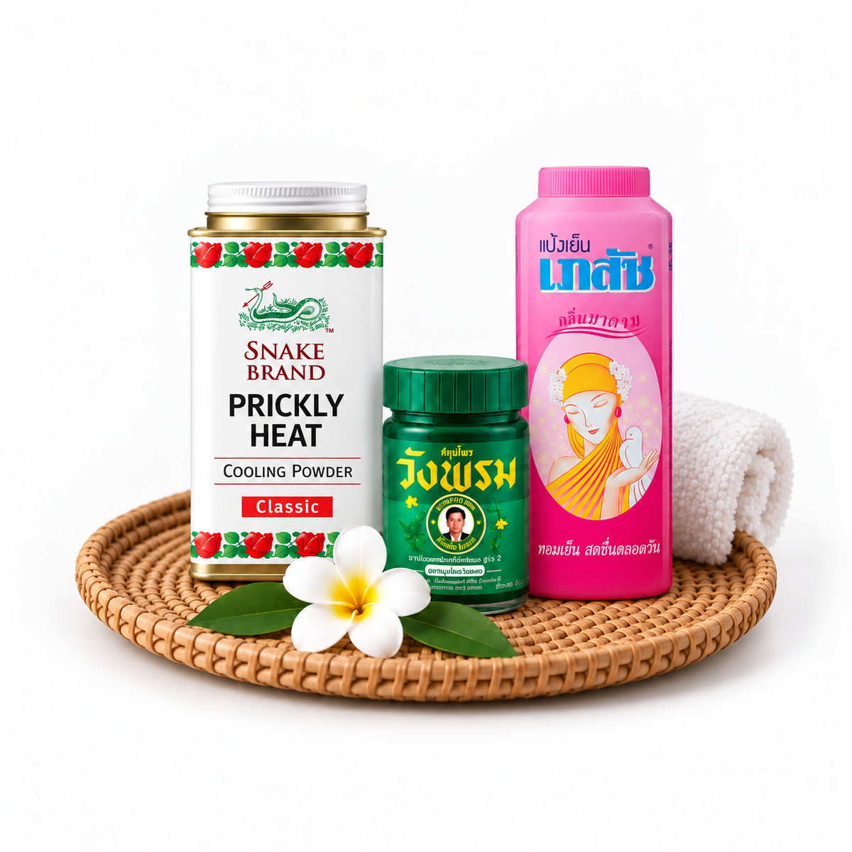 Thai cooling powders and herbal balm arranged on a rattan tray