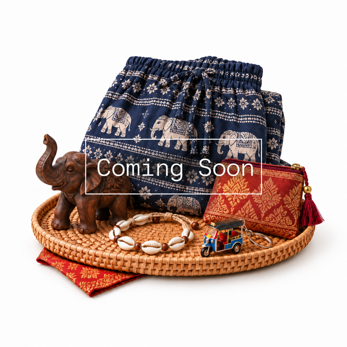 Thai souvenirs with larger Coming Soon outline on elephant-print fabric